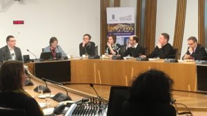 People sitting around a table in the Scottish Parliament