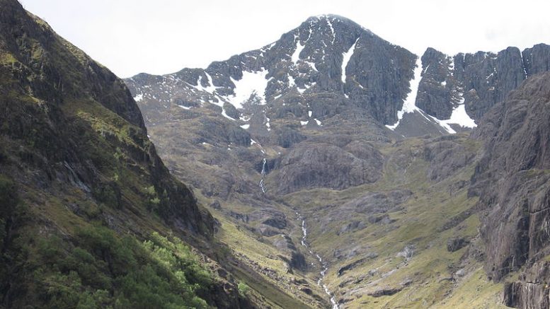 View of Scottish Highlands with glen leading up to mountain
