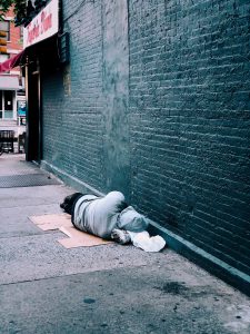 Photo of man lying in street