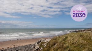 Photo of beach with Scotland 2030 logo