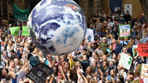 Giant globe floating over a large climate demonstration