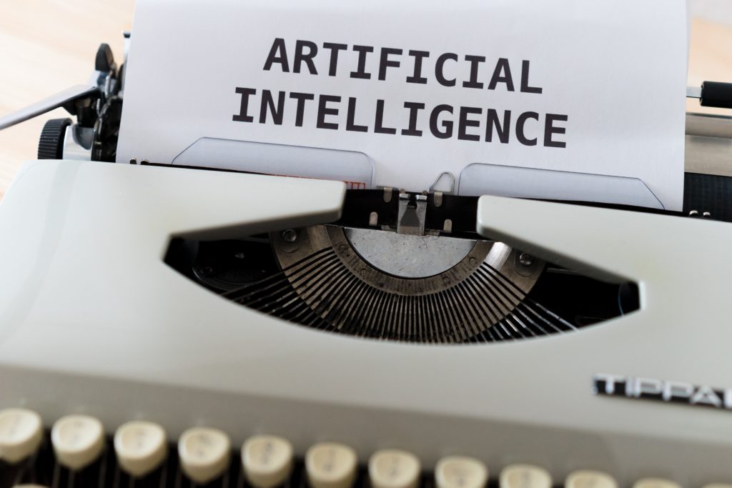 Typewriter with paper headed "Artificial Intelligence" Photo by Markus Winkler on Unsplash