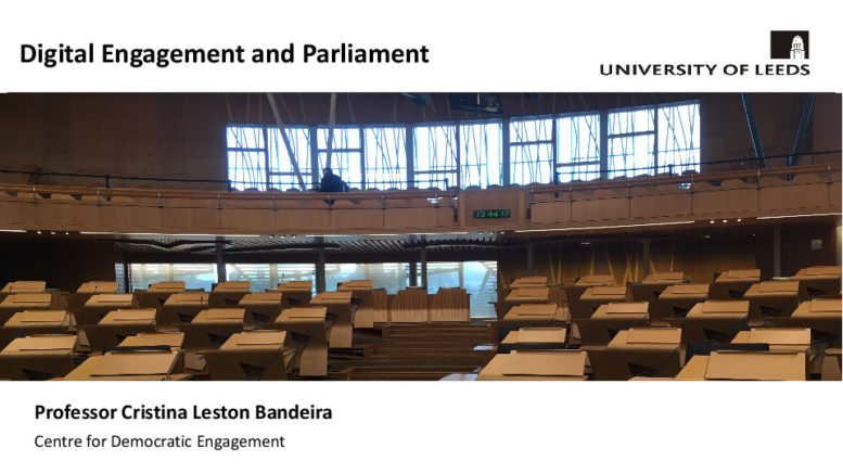 Image of Title slide of Cristina Bandeira's presentation Digital Engagement and Parliament - towards the rear of the Scottish Parliament Debating Chamber from the well